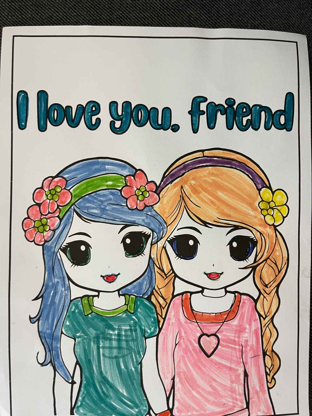 Finished I love you, friend coloring page using colored markers.