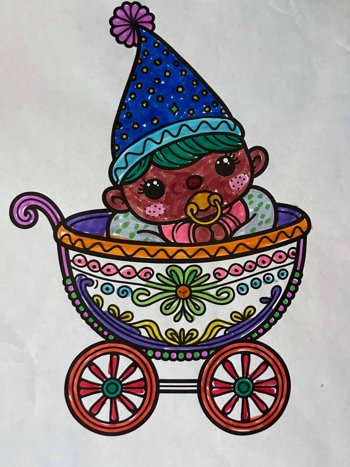 Baby gnome in a stroller finished coloring page.