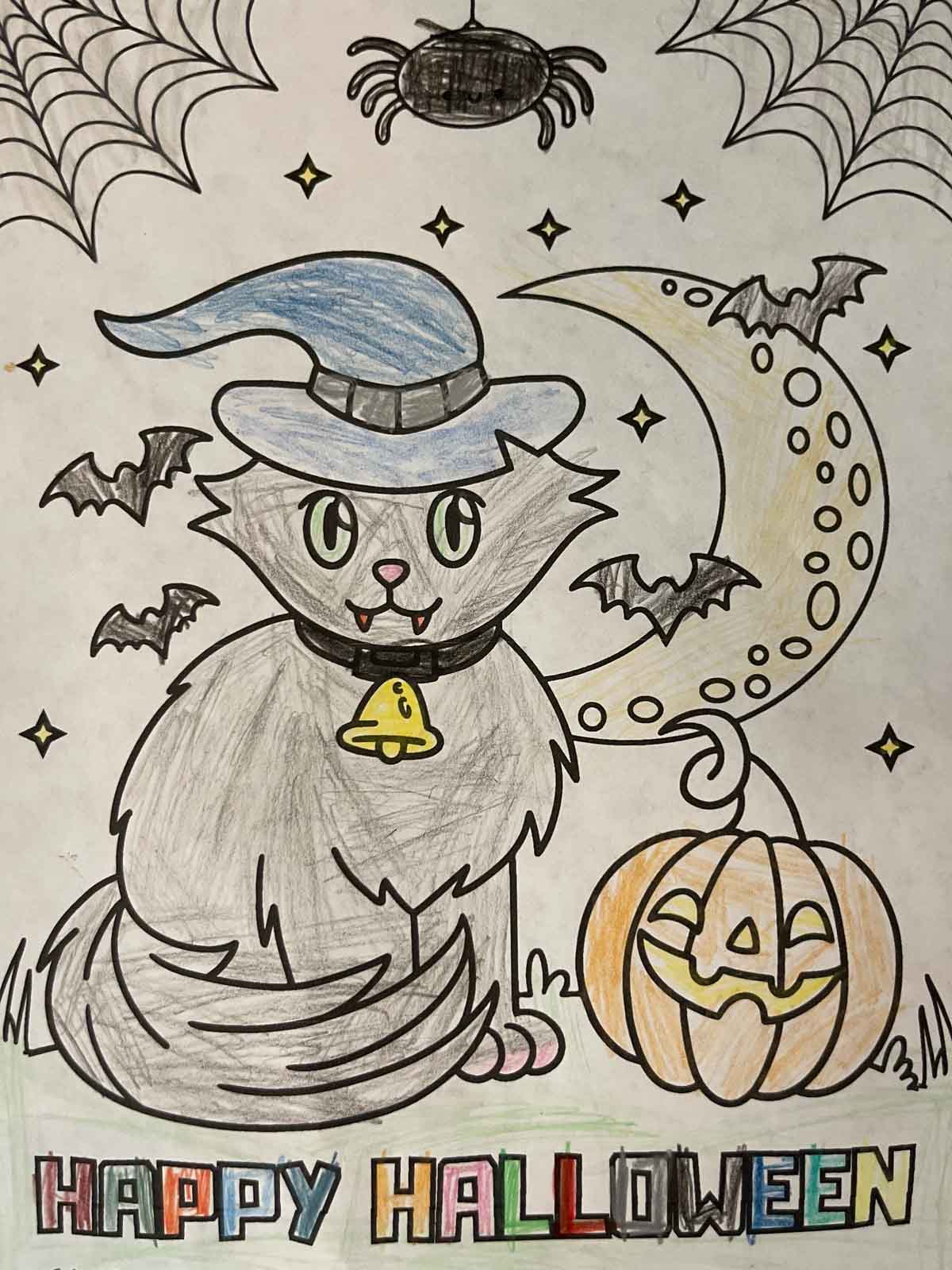 A happy Halloween coloring page colored by a kid.