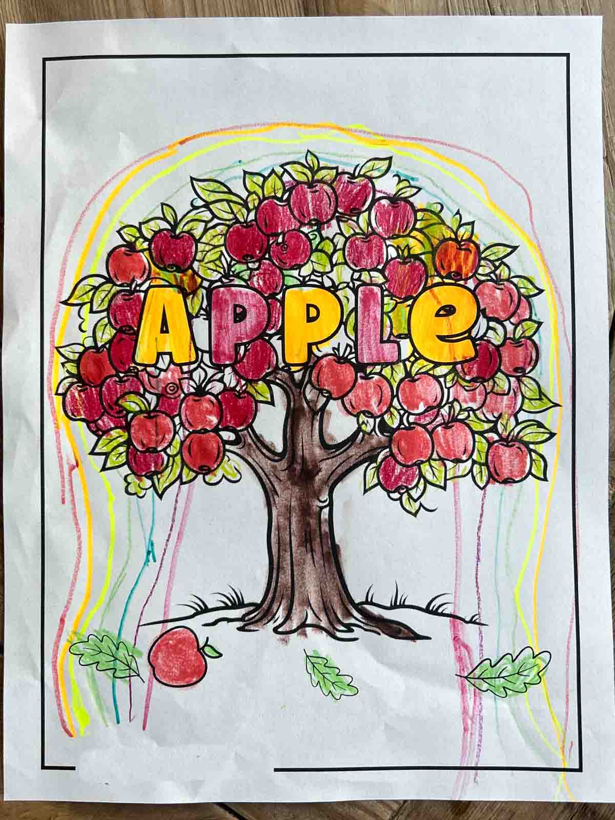 An apple coloring sheet colored in.