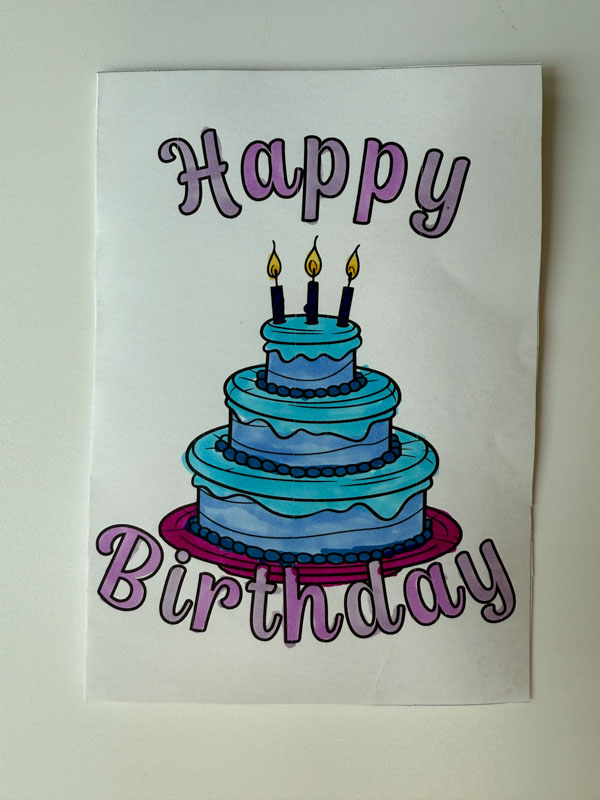 A happy birthday coloring page colored by a teen.