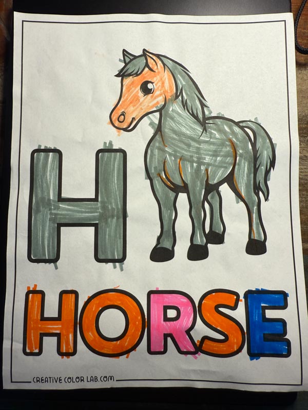 A colored horse coloring page by a kid.