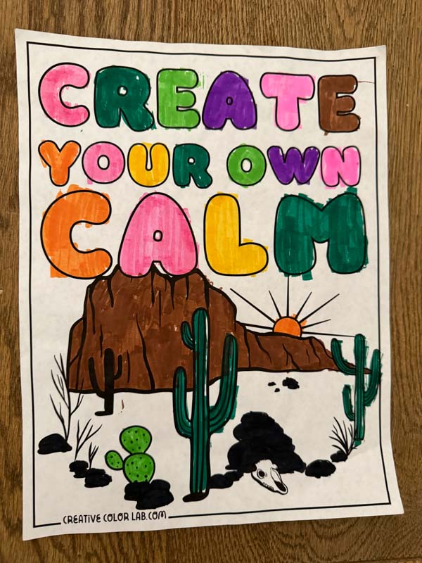 A positive quote coloring page colored using a colored pen.