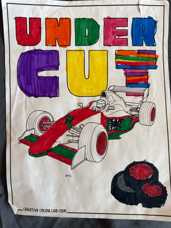 Completed race car coloring page.